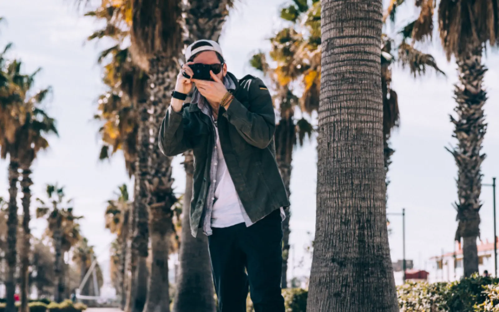 A photographer taking a picture outdoors